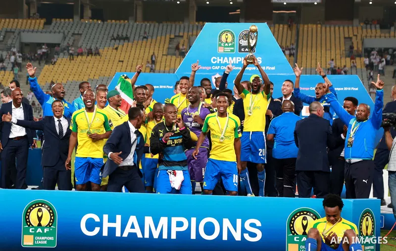 South Africa's Mamelodi Sundowns players celebrate after winning the CAF Champions League football competition following the final match against Egypt's Zamalek club on October 23, 2016 at the Borg el-Arab Stadium near A...