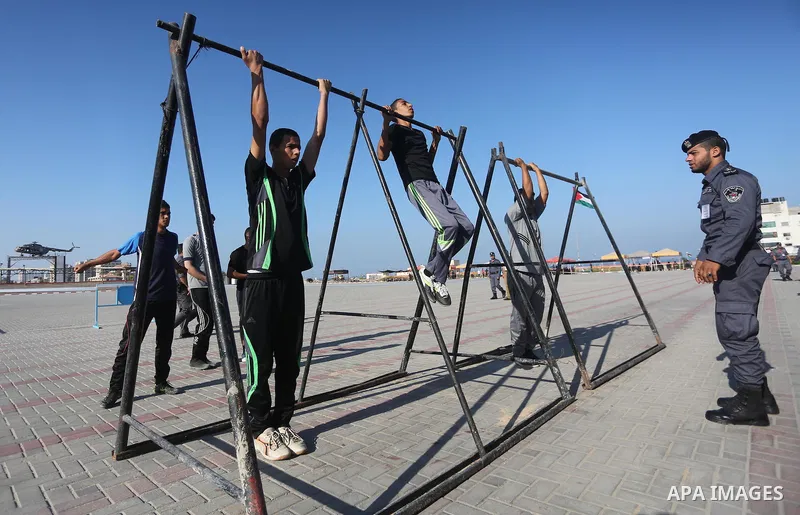 Palestinian applicants undergo a physical examination at a Hamas-run police recruitment centre in Gaza City October 24, 2016. Photo by Mohammed Asad