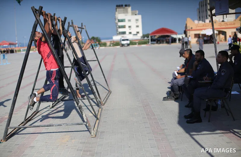 Palestinian applicants undergo a physical examination at a Hamas-run police recruitment centre in Gaza City October 24, 2016. Photo by Mohammed Asad
