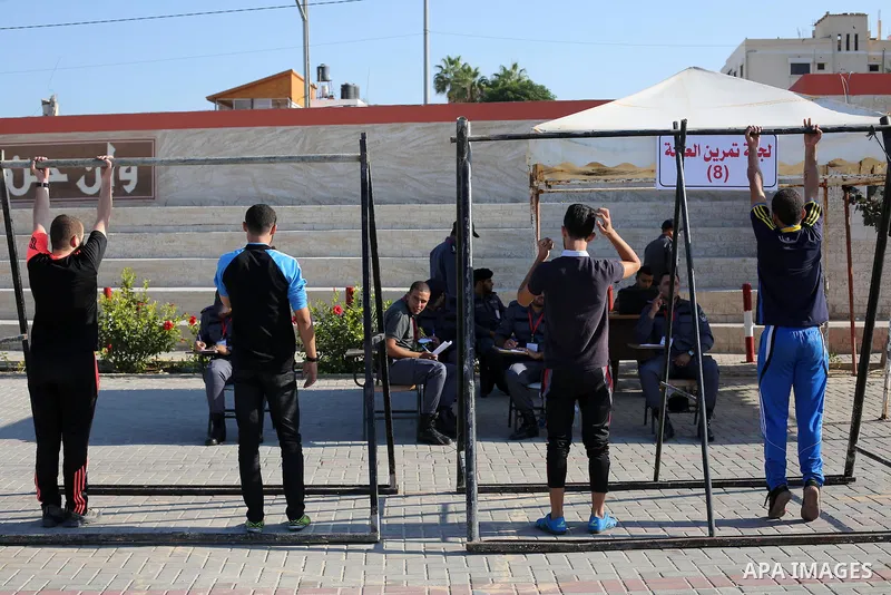 Palestinian applicants undergo a physical examination at a Hamas-run police recruitment centre in Gaza City October 24, 2016. Photo by Mohammed Asad