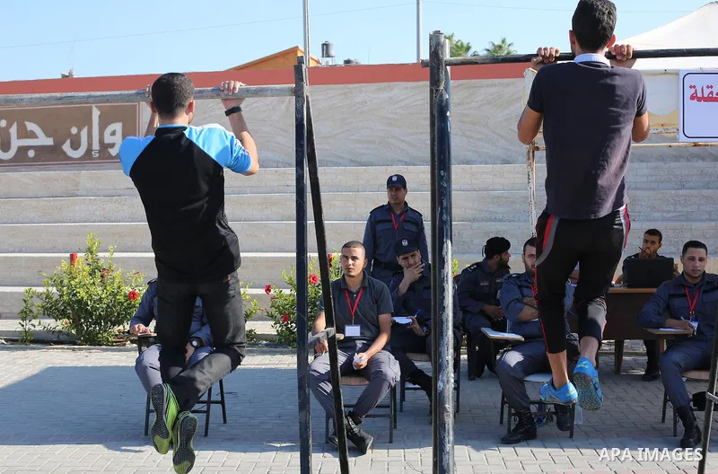 Palestinian applicants undergo a physical examination at a Hamas-run police recruitment centre in Gaza City October 24, 2016. Photo by Mohammed Asad