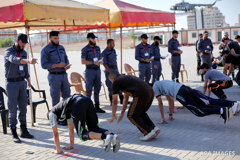 Palestinian applicants undergo a physical examination at a Hamas-run police recruitment centre in Gaza City October 24, 2016. Photo by Mohammed Asad