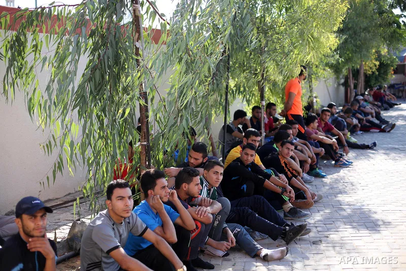 Palestinian applicants undergo a physical examination at a Hamas-run police recruitment centre in Gaza City October 24, 2016. Photo by Mohammed Asad
