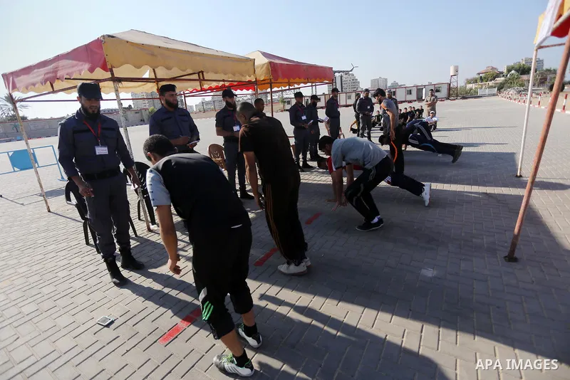 Palestinian applicants undergo a physical examination at a Hamas-run police recruitment centre in Gaza City October 24, 2016. Photo by Mohammed Asad