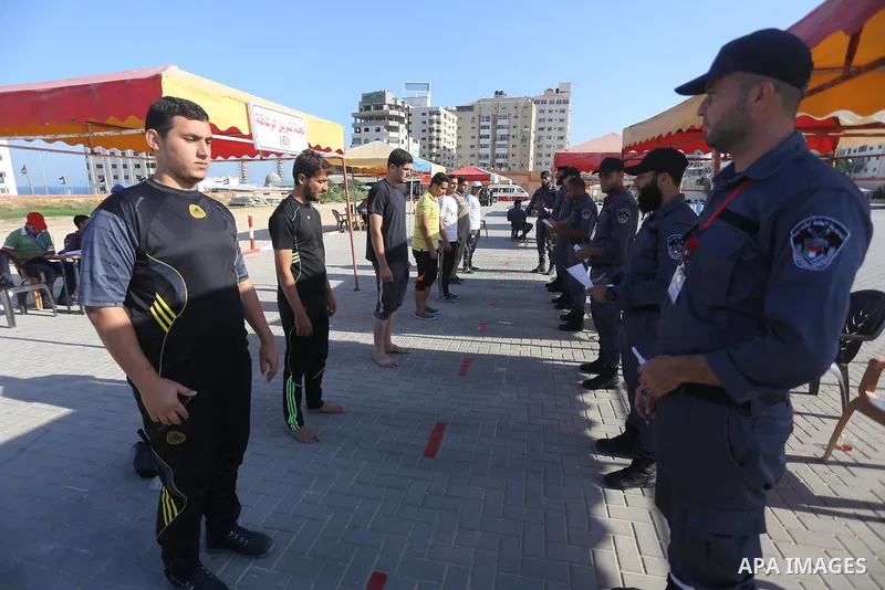 Palestinian applicants undergo a physical examination at a Hamas-run police recruitment centre in Gaza City October 24, 2016. Photo by Mohammed Asad
