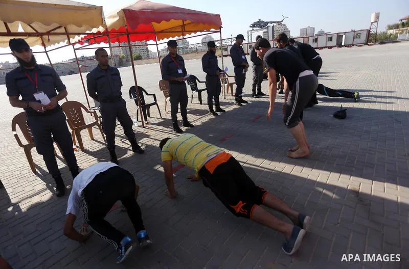 Palestinian applicants undergo a physical examination at a Hamas-run police recruitment centre in Gaza City October 24, 2016. Photo by Mohammed Asad