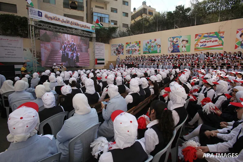 Palestinian students celebrate after winning the Best School Competition "challenge the Arab reading" of the more than 30 thousand schools in the Arab world, in the West Bank city of Nablus, on October 24, 2016. Photo by...