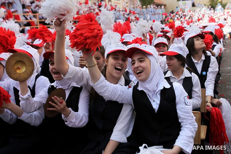 Palestinian students celebrate after winning the Best School Competition "challenge the Arab reading" of the more than 30 thousand schools in the Arab world, in the West Bank city of Nablus, on October 24, 2016. Photo by...