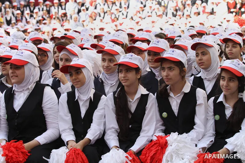 Palestinian students celebrate after winning the Best School Competition "challenge the Arab reading" of the more than 30 thousand schools in the Arab world, in the West Bank city of Nablus, on October 24, 2016. Photo by...