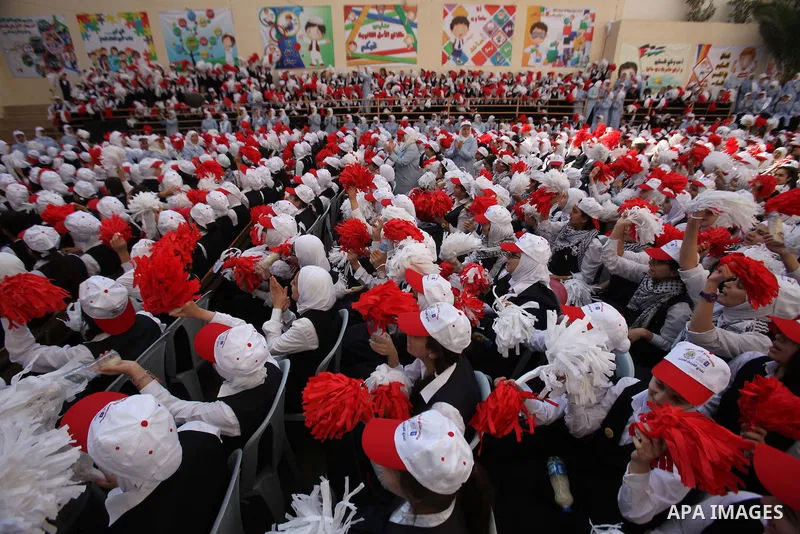 Palestinian students celebrate after winning the Best School Competition "challenge the Arab reading" of the more than 30 thousand schools in the Arab world, in the West Bank city of Nablus, on October 24, 2016. Photo by...