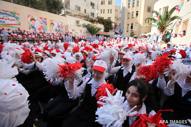 Palestinian students celebrate after winning the Best School Competition "challenge the Arab reading" of the more than 30 thousand schools in the Arab world, in the West Bank city of Nablus, on October 24, 2016. Photo by...