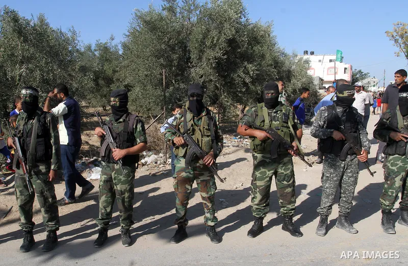 Members of the Ezzedine al-Qassam Brigades, the military wing of the Palestinian Islamist movement Hamas, attend the funeral of fellow Palestinian militant Amir Jaber Abu Taimeh in Khan Yunis in the southern Gaza Strip o...