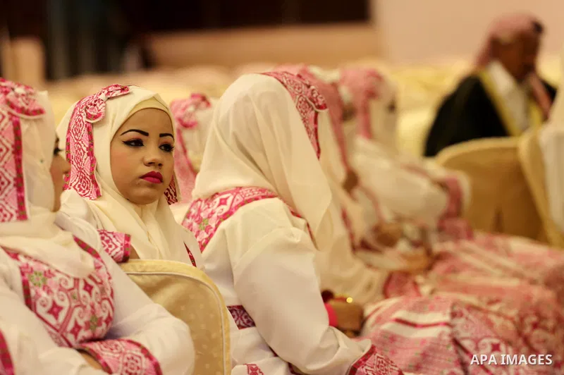 Palestinian brides take part in a mass wedding ceremony in Gaza city on Oct. 25, 2016. Nearly 20 Palestinian couples from War-wounded were married in a ceremony funded by the UAE government. Photo by Mohammed Asad