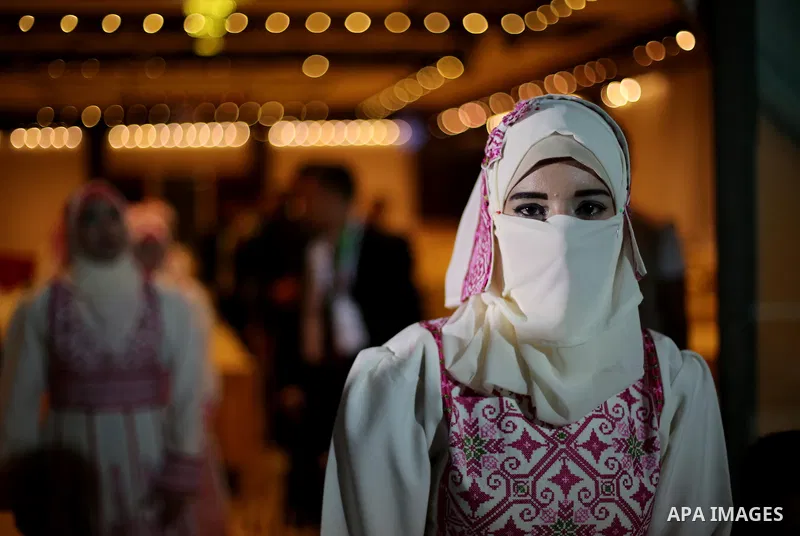 A Palestinian groom takes part in a mass wedding ceremony in Gaza city on Oct. 25, 2016. Nearly 20 Palestinian couples from War-wounded were married in a ceremony funded by the UAE government. Photo by Mohammed Asad