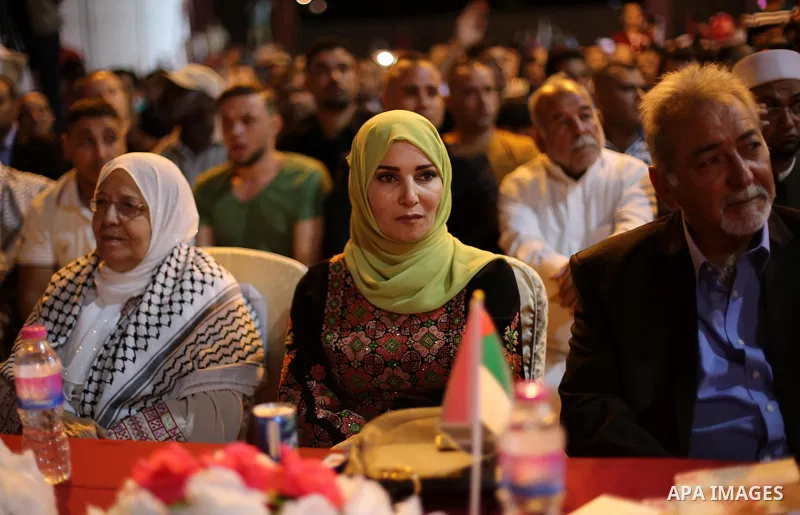 Ms. Jalila Dahlan attends a mass wedding ceremony in Gaza city on Oct. 25, 2016. Nearly 20 Palestinian couples from War-wounded were married in a ceremony funded by the UAE government. Photo by Mohammed Asad