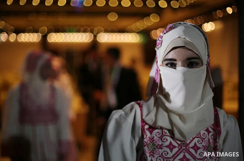 A Palestinian groom takes part in a mass wedding ceremony in Gaza city on Oct. 25, 2016. Nearly 20 Palestinian couples from War-wounded were married in a ceremony funded by the UAE government. Photo by Mohammed Asad