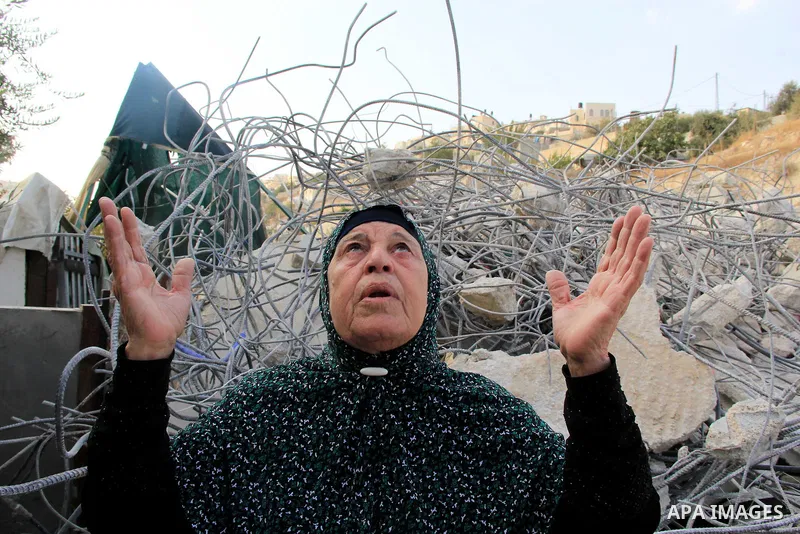 A Palestinian woman reacts following Israeli forces demolished her family house which Israeli authorities said it was built without a permit in Wadi Qaddum in the East Jerusalem neighborhood of Silwan on Oct. 26, 2016. A...