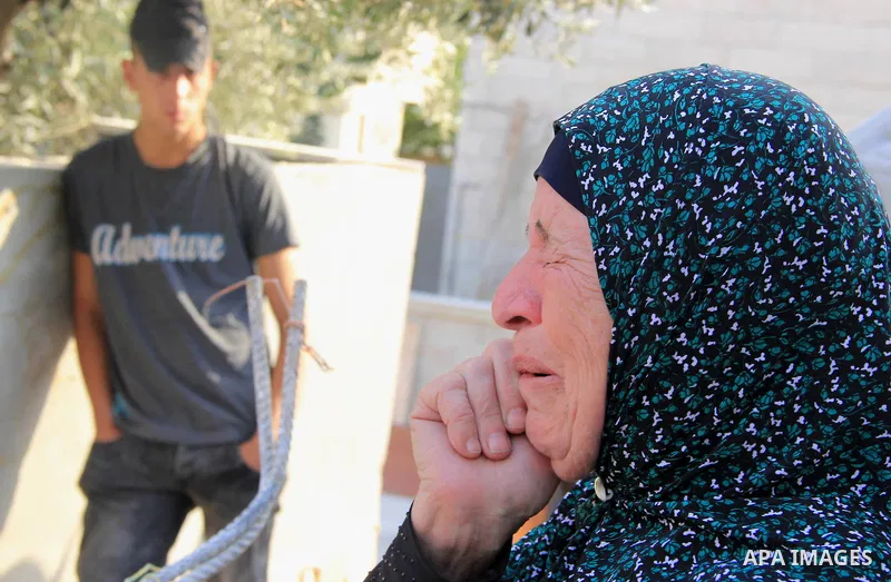 A Palestinian woman reacts following Israeli forces demolished her family house which Israeli authorities said it was built without a permit in Wadi Qaddum in the East Jerusalem neighborhood of Silwan on Oct. 26, 2016. A...
