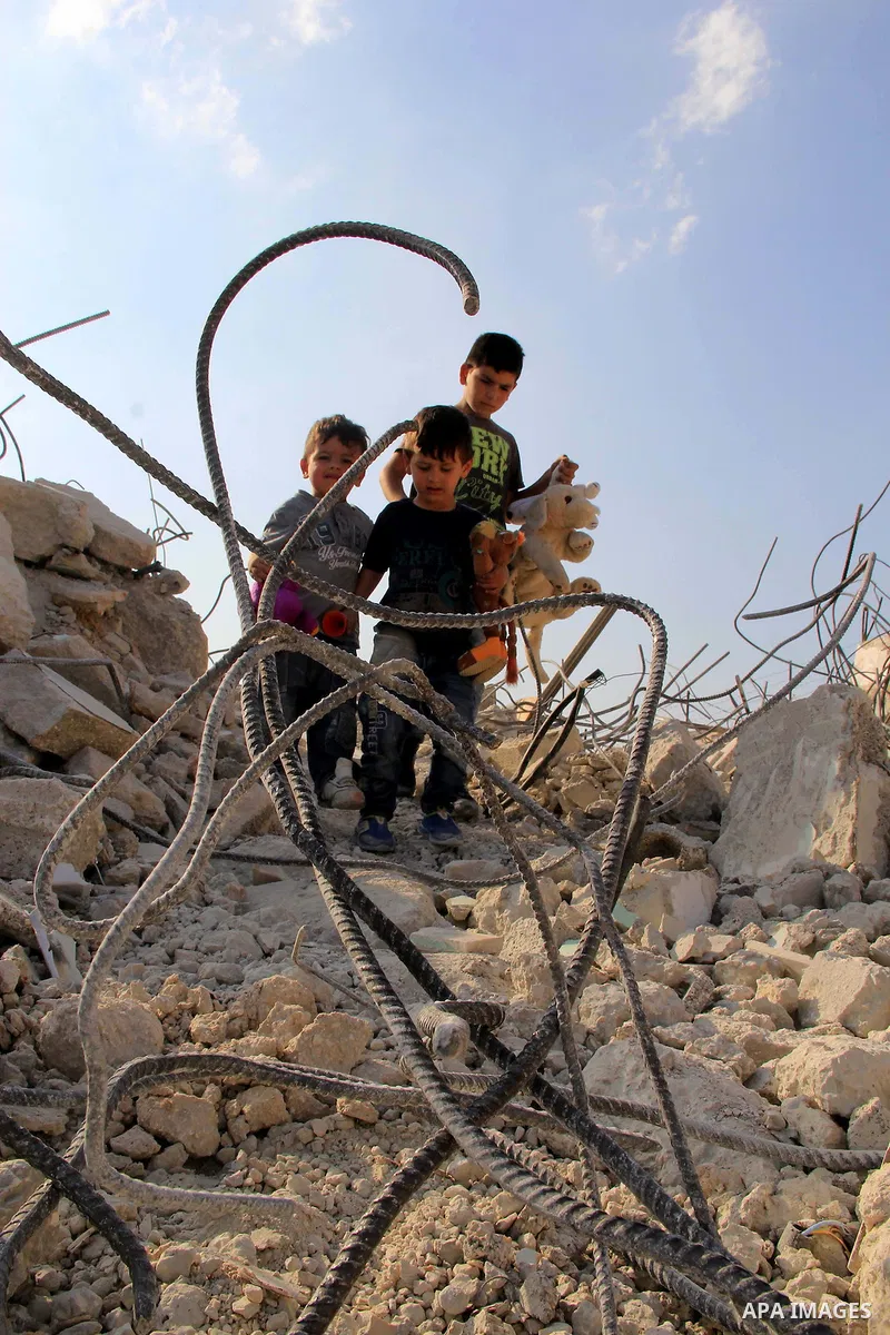 Palestinian children walk on the rubbles of their family house that was demolished after Israeli authorities said it was built without a permit in Wadi Qaddum in the East Jerusalem neighborhood of Silwan on Oct. 26, 2016...