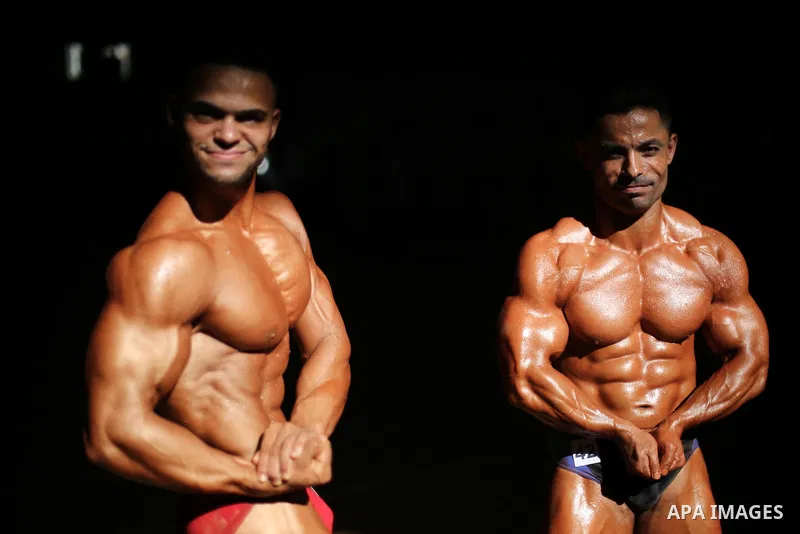 Palestinian men compete in a local bodybuilding competition in Gaza city on October 28, 2016. Photo by Mohammed Asad