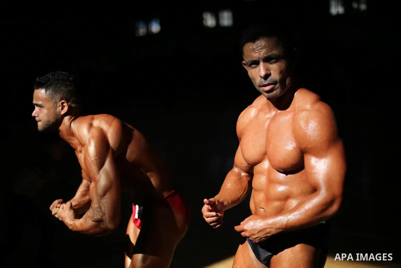 Palestinian men compete in a local bodybuilding competition in Gaza city on October 28, 2016. Photo by Mohammed Asad