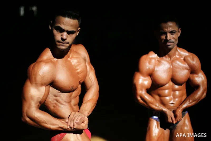 Palestinian men compete in a local bodybuilding competition in Gaza city on October 28, 2016. Photo by Mohammed Asad