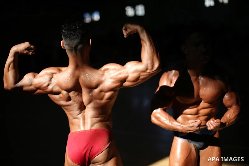 Palestinian men compete in a local bodybuilding competition in Gaza city on October 28, 2016. Photo by Mohammed Asad