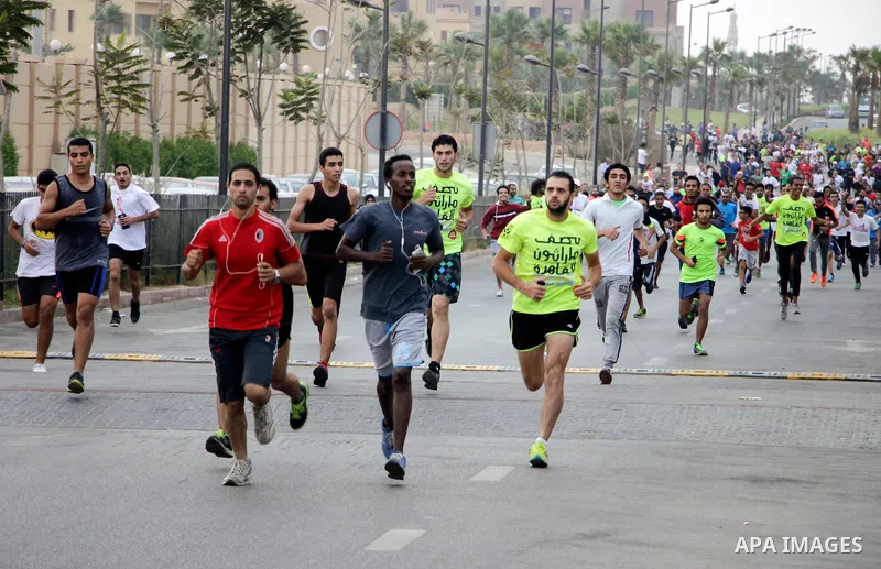 Egyptians run at street during a Marathon to raise awareness and funds to fight breast cancer, in Cairo, Egypt, on Oct. 28, 2016. Photo by Amr Sayed