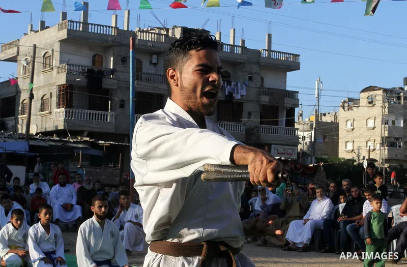 Palestinian children take part in a Karate graduation session at a club in Rafah, in the southern Gaza strip, on Oct. 28, 2016. Photo by Abed Rahim Khatib