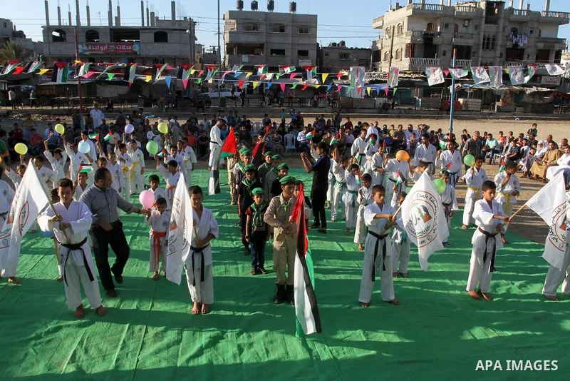 Palestinian children take part in a Karate graduation session at a club in Rafah, in the southern Gaza strip, on Oct. 28, 2016. Photo by Abed Rahim Khatib