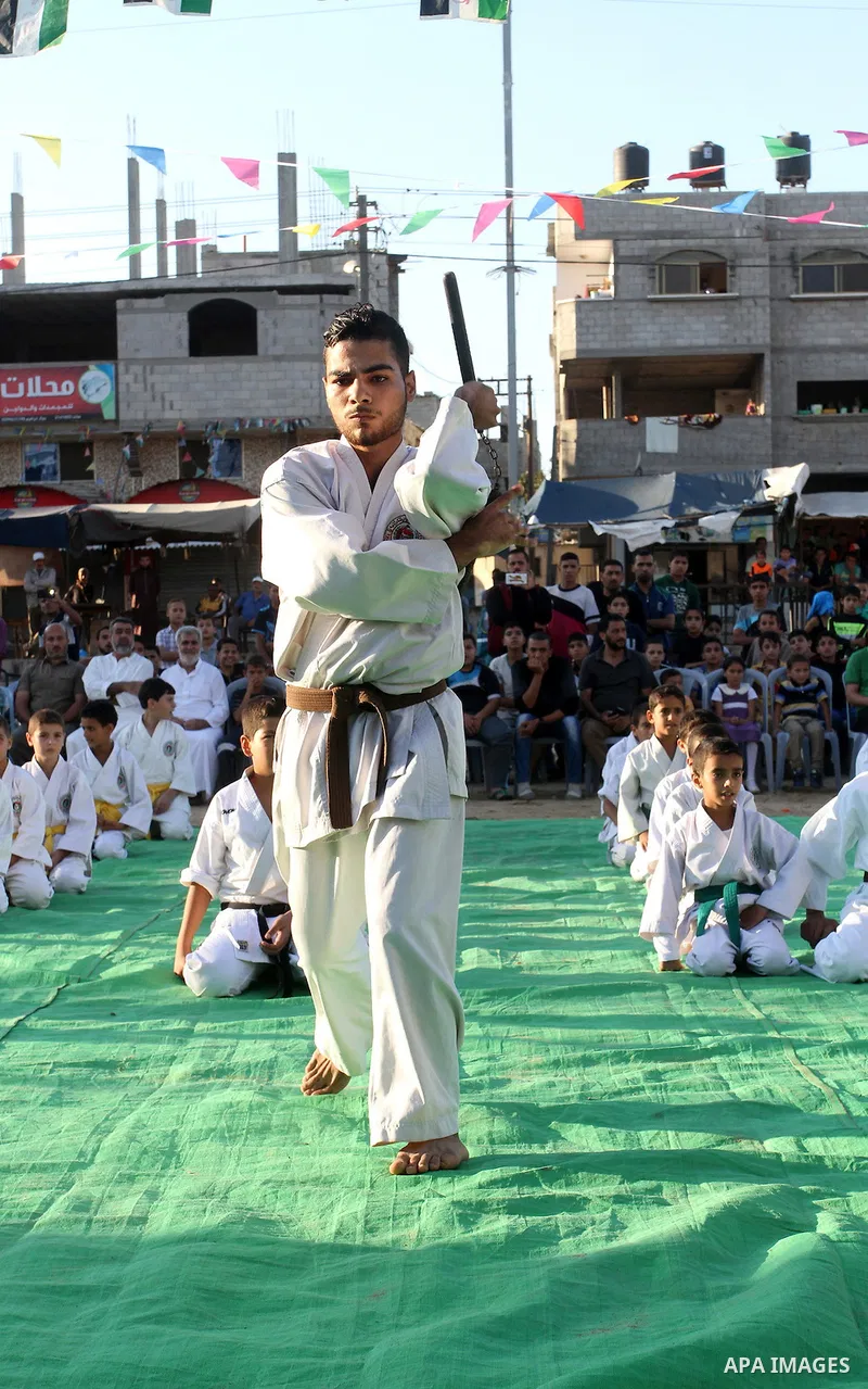 Palestinian children take part in a Karate graduation session at a club in Rafah, in the southern Gaza strip, on Oct. 28, 2016. Photo by Abed Rahim Khatib