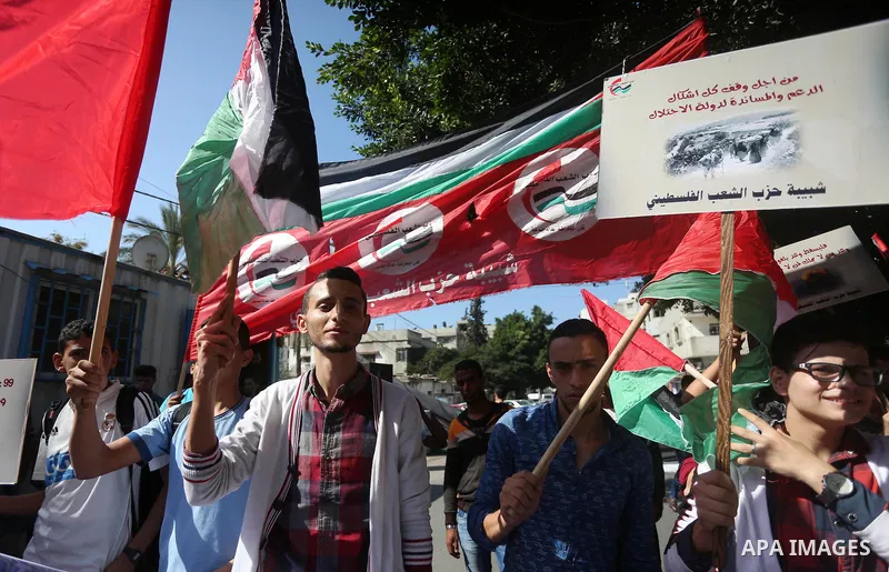 Palestinians hold banners during a demonstration in Gaza City to mark the anniversary of the Balfour Declaration on October 29, 2016. The 1917 Balfour Declaration is a formal statement of policy by the British government...