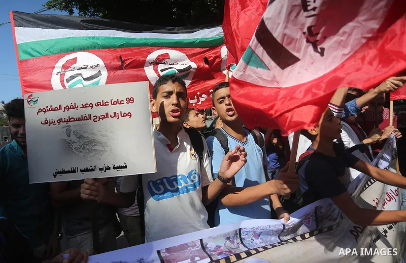 Palestinians hold banners during a demonstration in Gaza City to mark the anniversary of the Balfour Declaration on October 29, 2016. The 1917 Balfour Declaration is a formal statement of policy by the British government...