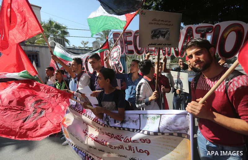 Palestinians hold banners during a demonstration in Gaza City to mark the anniversary of the Balfour Declaration on October 29, 2016. The 1917 Balfour Declaration is a formal statement of policy by the British government...