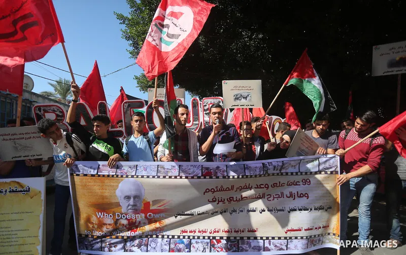 Palestinians hold banners during a demonstration in Gaza City to mark the anniversary of the Balfour Declaration on October 29, 2016. The 1917 Balfour Declaration is a formal statement of policy by the British government...