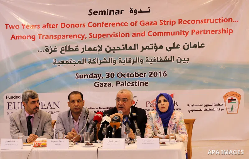 Palestinians take part in a seminar "Two years after donors' conference of Gaza Strip reconstruction", in Gaza city, on Ocyober 30, 2016. Photo by Mohammed Asad