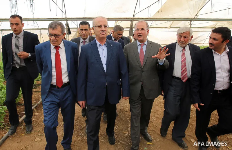 Palestinian Prime Minister, Rami Hamadallah, attends the Opening the Palestine Company for the production and marketing of fresh herbs,in Jeftlek village near Jordan Valley in the West Bank, on Oct 30, 2016. Photo by Pri...