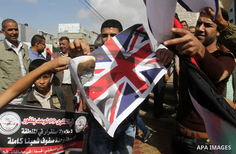 Palestinians burn Israeli and British flags during a demonstration to mark the anniversary of the Balfour Declaration, in Rafah in the southern Gaza strip, on November 1, 2016. The 1917 Balfour Declaration is a formal st...