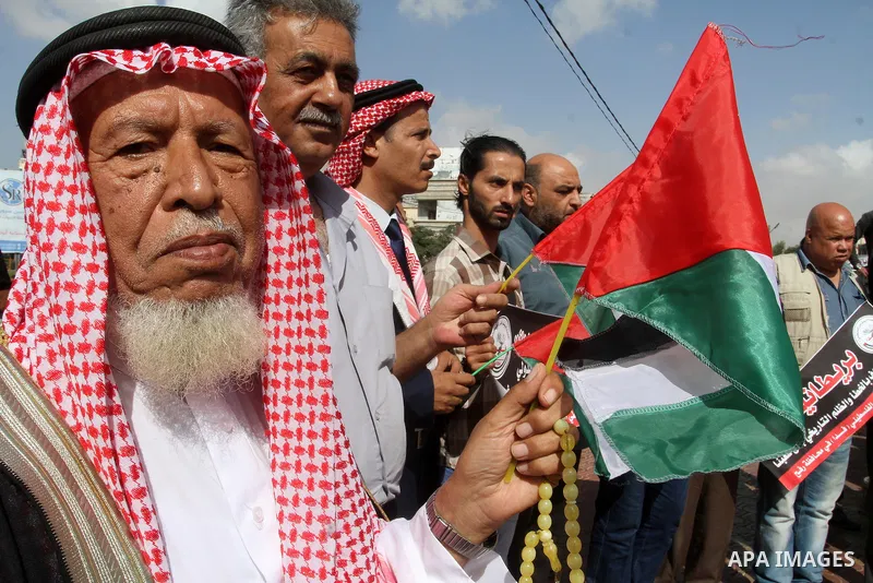 Palestinians hold banners during a demonstration to mark the anniversary of the Balfour Declaration, in Rafah in the southern Gaza strip, on November 1, 2016. The 1917 Balfour Declaration is a formal statement of policy...
