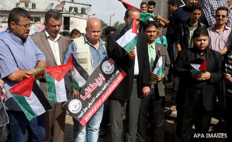 Palestinians hold banners during a demonstration to mark the anniversary of the Balfour Declaration, in Rafah in the southern Gaza strip, on November 1, 2016. The 1917 Balfour Declaration is a formal statement of policy...