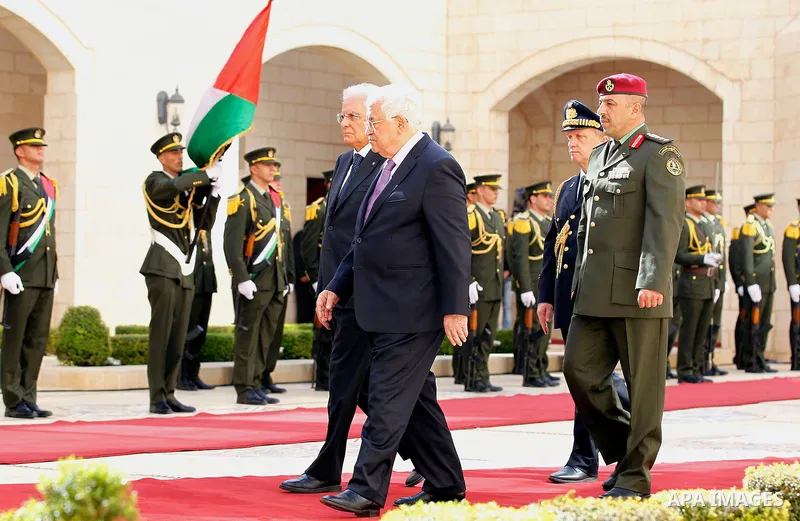 Palestinian President Mahmoud Abbas gestures as he welcomes Italy's President Sergio Mattarella during a welcoming ceremony in the West Bank city of Bethlehem November 1, 2016. Photo by Wisam Hashlamoun