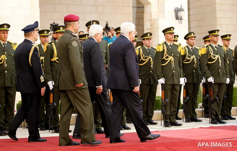 Palestinian President Mahmoud Abbas gestures as he welcomes Italy's President Sergio Mattarella during a welcoming ceremony in the West Bank city of Bethlehem November 1, 2016. Photo by Wisam Hashlamoun