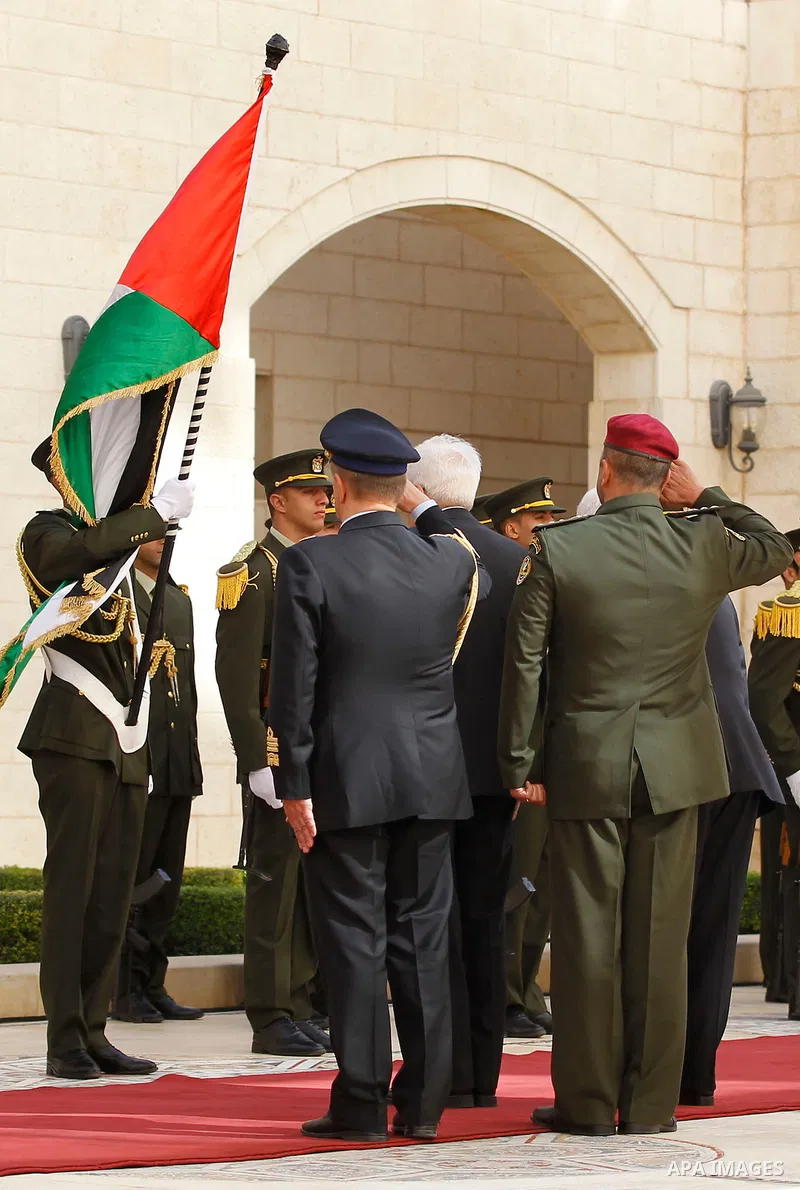 Palestinian President Mahmoud Abbas gestures as he welcomes Italy's President Sergio Mattarella during a welcoming ceremony in the West Bank city of Bethlehem November 1, 2016. Photo by Wisam Hashlamoun