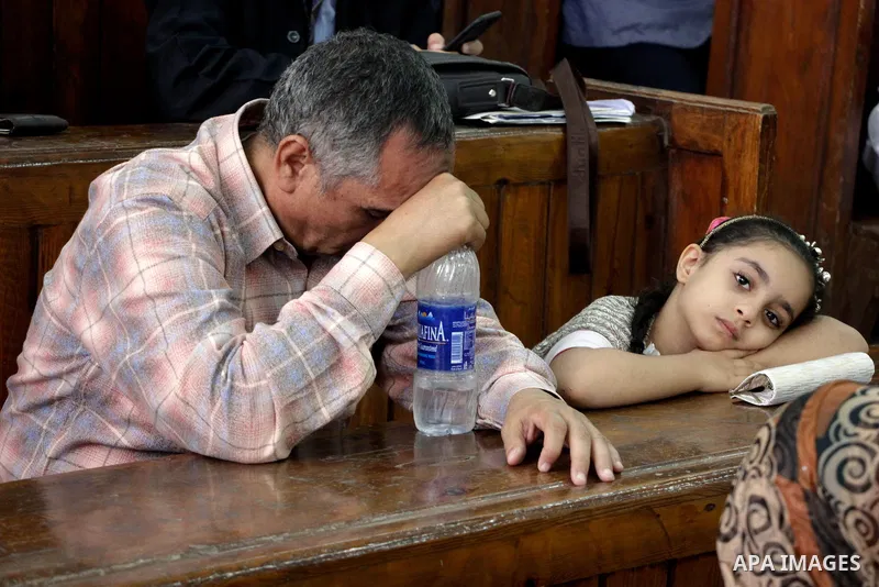 Relative of Egyptian Muslim Brotherhood defendants attend their trial, in a case known in media as "Rabaa Operations Room", in Cairo, on Nov. 1, 2016. Photo by Amr Sayed