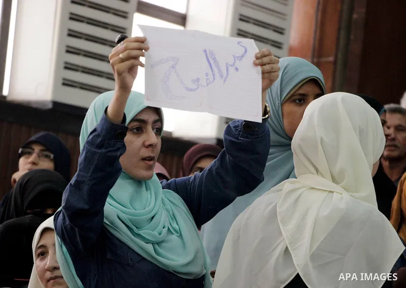 Relative of Egyptian Muslim Brotherhood defendants attend their trial, in a case known in media as "Rabaa Operations Room", in Cairo, on Nov. 1, 2016. Photo by Amr Sayed