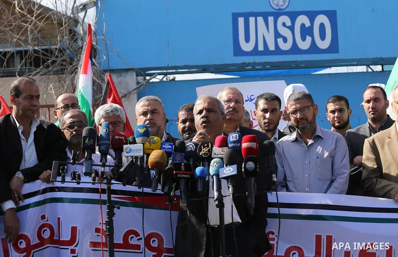 Palestinians hold banners during a demonstration to mark the anniversary of the Balfour Declaration, outside the UNESCO headquarters in Gaza city, on November 2, 2016. The 1917 Balfour Declaration is a formal statement o...