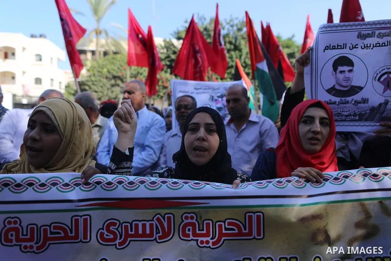 Palestinian supporters of the Popular Front for the Liberation of Palestine (PFLP), take part during a protest to show solidarity with Palestinian prisoners on hunger strike in Israeli Jails, in Gaza city on November 3,...