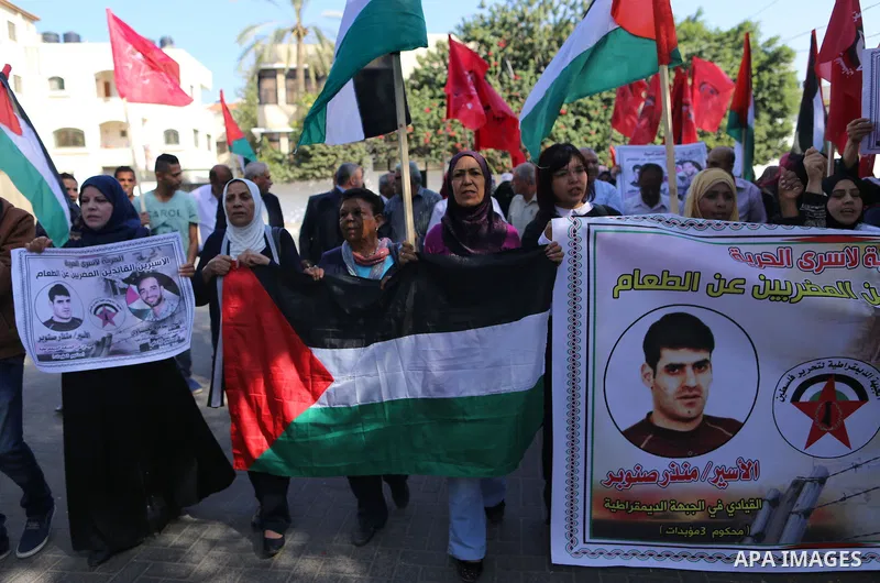 Palestinian supporters of the Popular Front for the Liberation of Palestine (PFLP), take part during a protest to show solidarity with Palestinian prisoners on hunger strike in Israeli Jails, in Gaza city on November 3,...