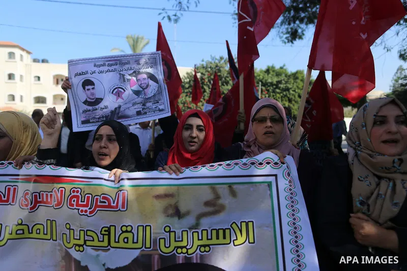 Palestinian supporters of the Popular Front for the Liberation of Palestine (PFLP), take part during a protest to show solidarity with Palestinian prisoners on hunger strike in Israeli Jails, in Gaza city on November 3,...