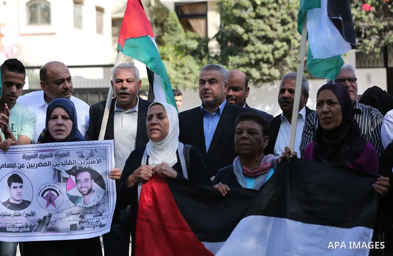 Palestinian supporters of the Popular Front for the Liberation of Palestine (PFLP), take part during a protest to show solidarity with Palestinian prisoners on hunger strike in Israeli Jails, in Gaza city on November 3,...